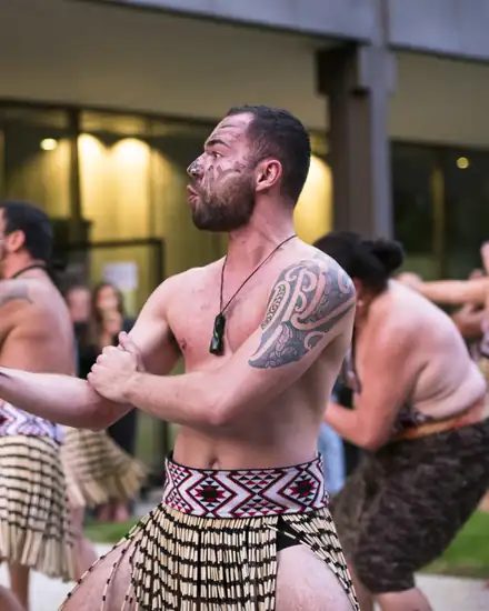 Ben Appleton, facilitator and performer at Haka International, performing a haka