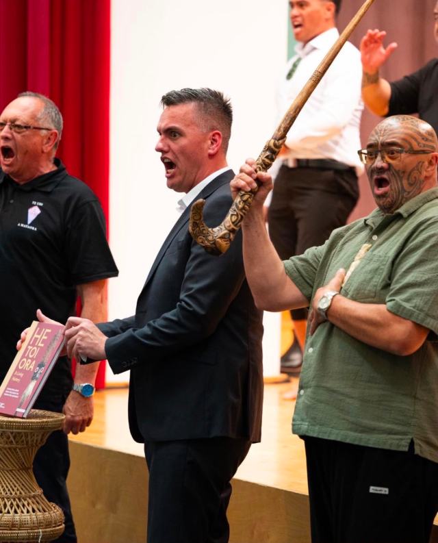 Book and exhibition launch — David Jones performing a haka with a taiaha