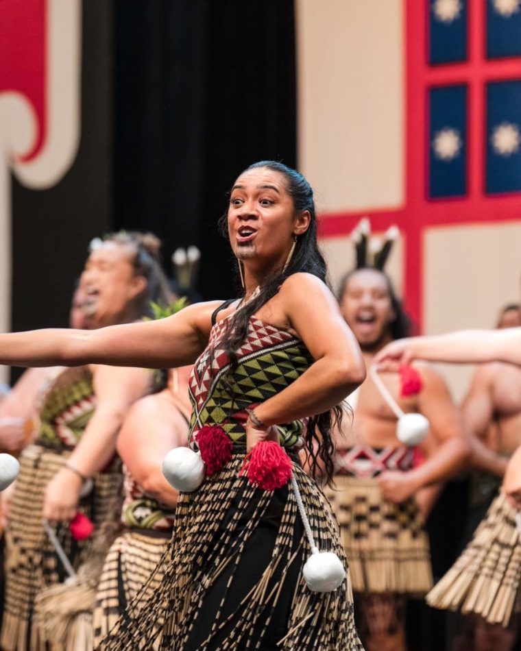 Kerira Tapene, Lead Facilitator at Haka International, performing with poi at Te Matatini