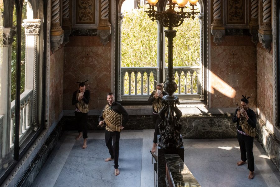 Haka International kaihaka performing karakia with pukaea in a Venetian palazzo