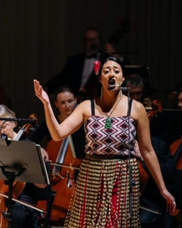 Roimata Kautai, Lead Facilitator at Haka International, performing waiata with an orchestra